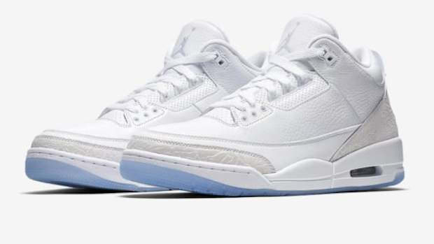 View of white and grey Air Jordan shoes.